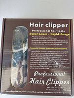 Box front showing Hair Clipper branding and features such as titanium plated blade, super power, rapid charge, and professional quality.