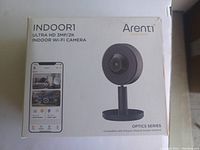 Front view of the Arenti Indoor WiFi Camera box showing model, resolution, and compatibility information.