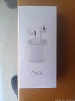Photo of the boxed Pro 4 wireless earbuds showing the product image on the front of the box.