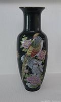 Front view showing detailed painted pheasants and flowers on black background