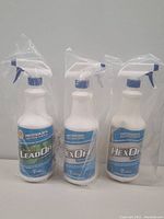 Front view of three spray bottles labeled Lead Off, Lex Off, and Hex Off, wrapped in clear plastic.