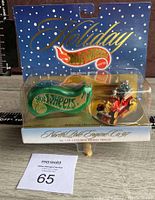 Front view of Holiday Hot Wheels 1997 North Pole Engine Company No. 97 in original packaging with green showcase turntable and red train engine with elves on Christmas tree.