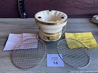 Full set showing ceramic hibachi grill, two metal grilling racks, and instruction sheets in Japanese.