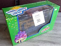 Front view of the boxed LGB Pustefix bubble blowing train car in green packaging showing bubbles graphic and product branding.