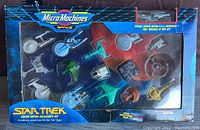 Front view of boxed Micro Machines Star Trek limited edition set showing 15 miniature spacecraft including a special edition U.S.S. Enterprise.