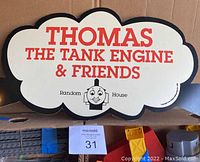 Photo of a cloud-shaped Thomas the Tank Engine & Friends sign included in the lot.