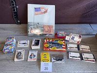 Full lot overview showing multiple World War II trading card sets including boxes, loose cards, and collector series cards spread on a wooden surface.