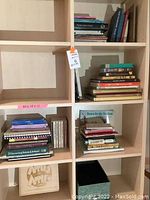 Books arranged on shelves with varied titles and sizes