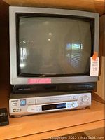 Front view of the Toshiba 20 inch CRT TV and Sony Hi-Fi Stereo VCR stacked together showing the devices in their entirety