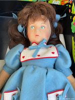 Close-up of the Lenci doll's face and outfit showing detailed clothing and facial features.