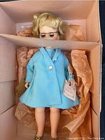Full doll in original box showing clothing and storage condition