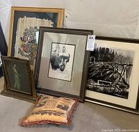 View of all items in the lot showing the two signed prints by Wagner, antique photo frame, and US Army pillow