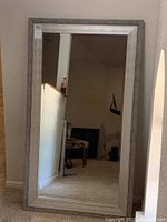 Full view of the large framed wall mirror showing size and overall condition