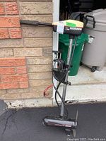 Side view showing the full trolling motor with 3 HP MinnKota branding and attached cables.