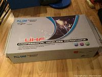 Box of PLL-UHF Professional Wireless Microphone ATL Audio UGX41 with stage musician graphic and product features listed.