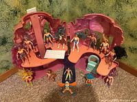 Full view of pink Crystal Castle playset opened with two levels and assembled figures