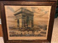 Framed print showing Arc de Triomphe and crowd celebrating.