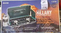 Box image of Sir Edmund Hillary branded two burner propane camp stove by Sears, showing product features and branding