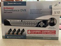Box front showing Bunker Hill 8-Channel Surveillance DVR with 4 Cameras, highlighting 500GB hard drive and 8 channel capability.