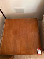Top view of wooden coffee table showing the surface and wood grain