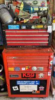 Full view of two-piece toolbox stack with stickers and top clutter