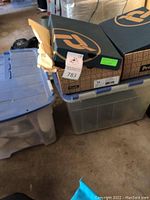 Storage bins with shoe boxes on top.