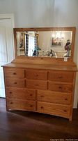 Full front view of oak mule chest and mirror