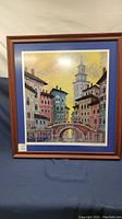 Full view of the framed print showing Venice canal scene with buildings and bridge, signed by Anatole Krasayansky.