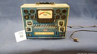 Front view of the entire Eico Model 625 tube tester showing the analog meter, multiple tube sockets, switches, and labels.