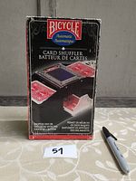 Front view of the Bicycle Automatic Card Shuffler box showing product image and branding.