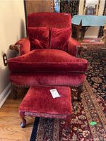 Front view of chair and ottoman showing upholstery and pillows