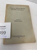 Front cover of the book showing the title 'American Railway Signaling Principles and Practices', chapter XIV 'Definitions' and publication details from 1953 by the Signal Section, A.R., Chicago.