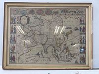 Full view of the framed vintage map of Asia with visible frame and reflections on the glass.