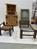 Full view of the twig-style doll furniture set including bed, chair, buffet and screen door
