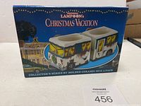 Photo of the box showing the set title, movie reference, and image of two RV-shaped mugs.