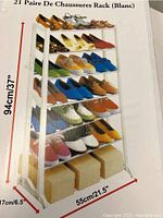 Photo of the shoe rack packaging showing the assembled product loaded with shoes and dimension markings.