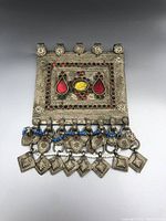 Front view of the rectangular Afghan Kuchi tribal gypsy pendant showing detailed metalwork, glass inlays, and dangling charms.