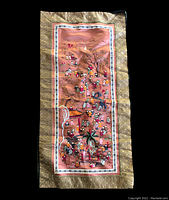 Full view of rectangular Chinese silk textile artwork depicting 100 boys in colorful traditional attire in a scenic outdoor setting with buildings and trees, bordered by gold patterned fabric.