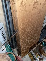 Room divider folded and photographed from the front showing detailed fabric pattern and condition.