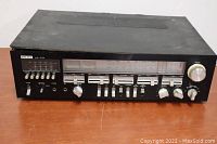 Front view of the Audio Reflex AR-164 receiver showing all control knobs, tuning dial, and overall condition.