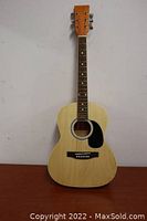 Full front view of Spectrum AIL36K acoustic guitar in natural wood finish showing body, neck, and headstock.