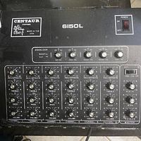 Top view showing Centaur Systems 6150L audio mixer controls with six channel volume, bass, treble, and effect knobs, equalizer and master section with power switch.