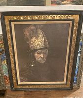 Framed portrait painting showing a man wearing an ornate helmet and dark clothing