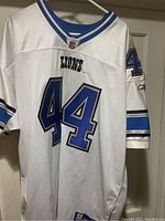Front view of Detroit Lions white football jersey displaying number 44 and Lions logo