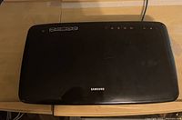 Top view of Samsung home theater unit showing brand logo and control buttons