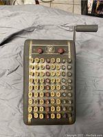 Top view of the F&E Check Protector showing numbered keys and manual crank