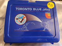 Top front view of blue Toronto Blue Jays lunch pail showing team logo, Loblaws logo, and baseball player graphics