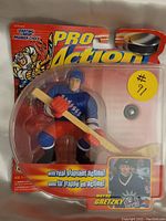 Front view of Wayne Gretzky New York Rangers Pro Action hockey figure in sealed packaging showing figure, puck and stick, with product branding.