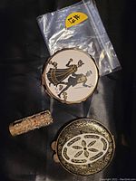 Photo of vintage vanity lot items including two compacts and a rhinestone lipstick case.