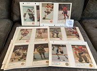 Photo showing multiple NHL action player photos mounted on album pages, featuring players from various teams including Montreal Canadiens and Boston Bruins.